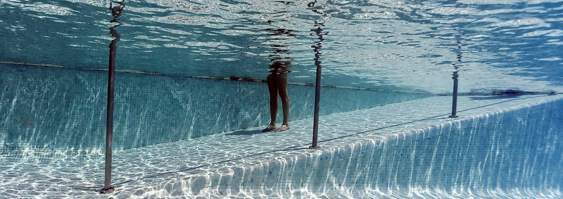 A woman cools off in a pool as Spain experiences a heatwave, in Madrid on June 23, 2026, during the heat wave affecting the Iberian Peninsula.
